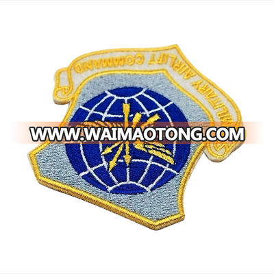 gold yarn embroidered blue earth badges with nerrowed border